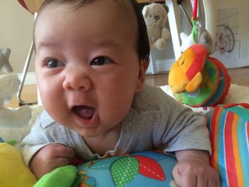 Portrait of cute baby girl with toy