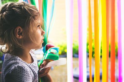 Close-up of girl with multi colored hair