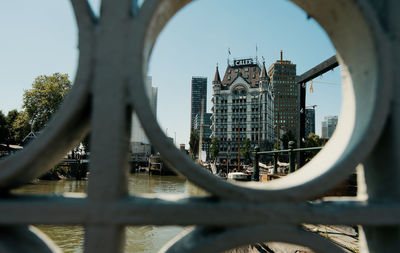 Buildings in city against sky