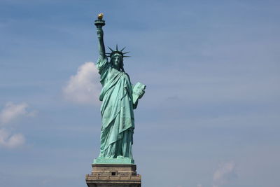 Low angle view of statue against sky