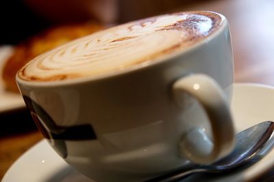 Close-up of cappuccino on table