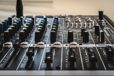 Close-up of sound mixer in recording studio