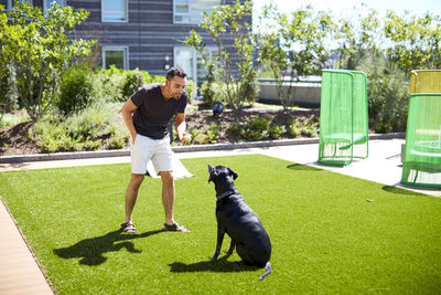 Full length of man with dog