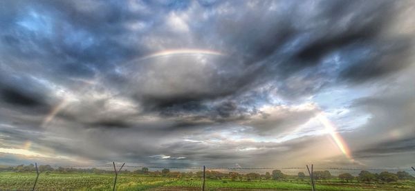 Scenic view of rainbow over field