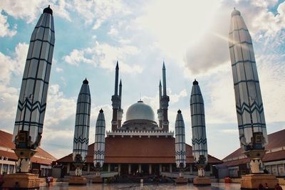 Panoramic view of buildings in city against sky