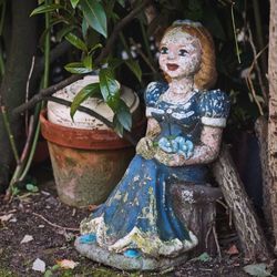 Close-up of buddha statue in yard