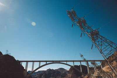 Mike ocallaghanpat tillman memorial bridge at hoover dam against blue sky