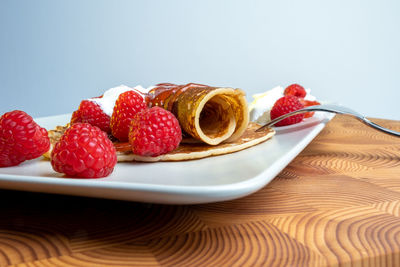 Close-up of strawberries in plate on table