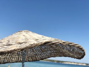 Low angle view of roof against blue sky