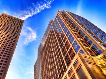 Low angle view of modern building against blue sky