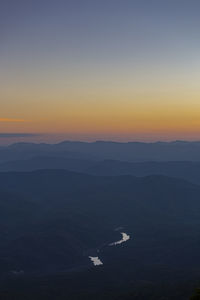 High angle view of silhouette mountain against sky during sunset