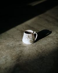 High angle view of cup on table