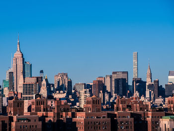 View of cityscape against clear sky