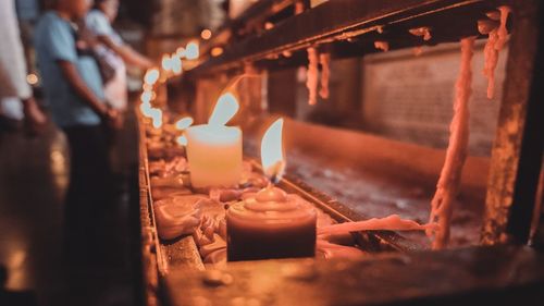 Lit candles in temple