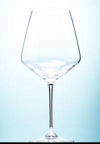 Close-up of wineglass against white background