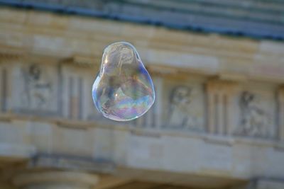 Low angle view of bubble against historic building