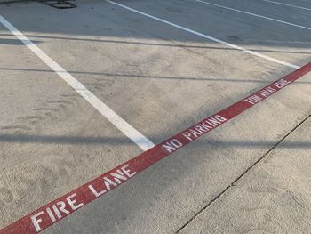 High angle view of arrow sign on road