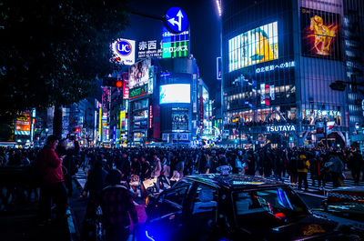 Crowd in city at night in tokyo japan