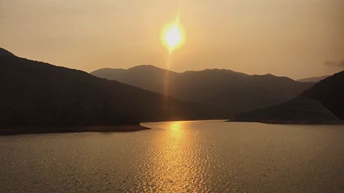 Scenic view of sunset over river