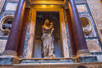 Low angle view of statue against building