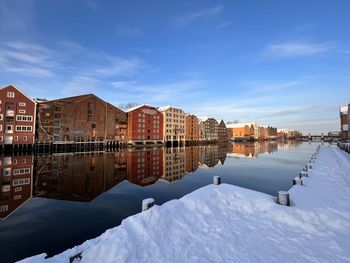 Reflection of buildings in water in trondheim