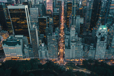 High angle view of illuminated buildings in city at night