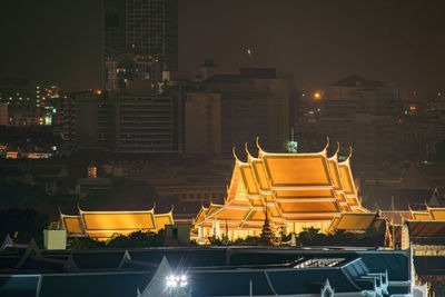 High angle view of illuminated buildings at night