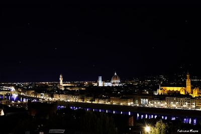 Illuminated cityscape at night