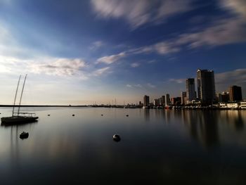 Sailboats in sea against sky