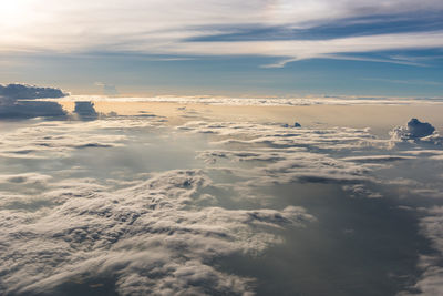 Aerial view of sea against sky during sunset