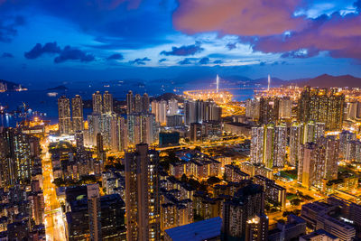 Aerial view of illuminated buildings in city at night