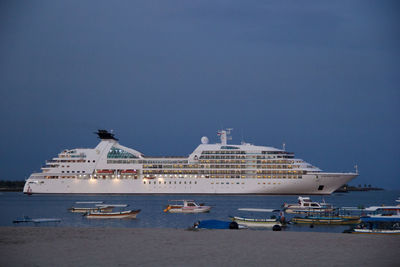 Boats in sea against sky