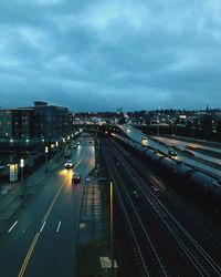 High angle view of railroad tracks against sky in city
