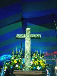 Low angle view of cross against blue sky