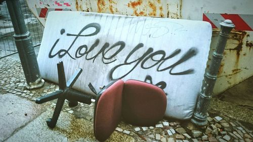 Close-up of text on wall