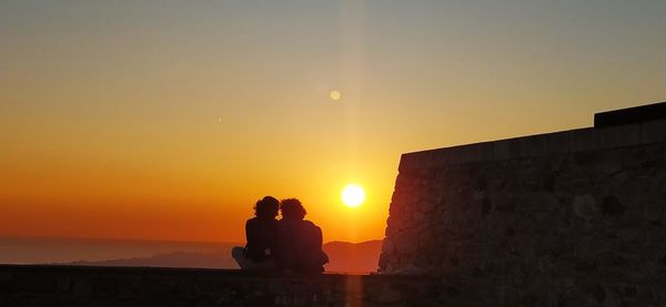 Silhouette people at sunset