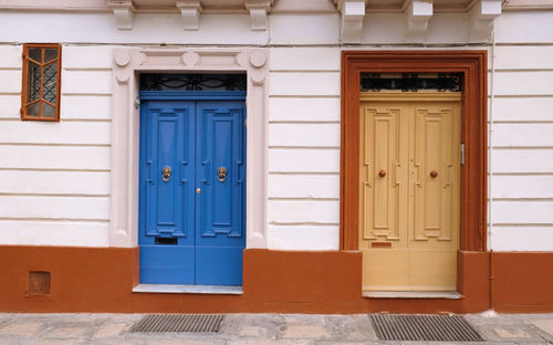 Traditional vintage painted wooden door and exterior in malta. entrance to typical maltese houses.