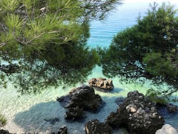 High angle view of rocks in sea