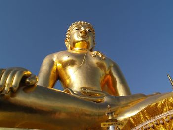 Low angle view of statue against sky