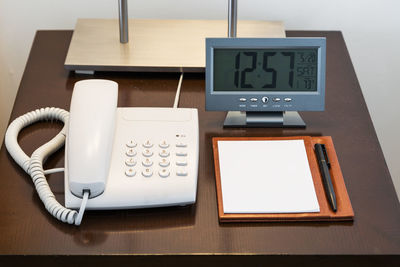 High angle view of telephone on table