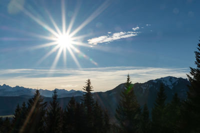 Low angle view of snowcapped mountains against sky