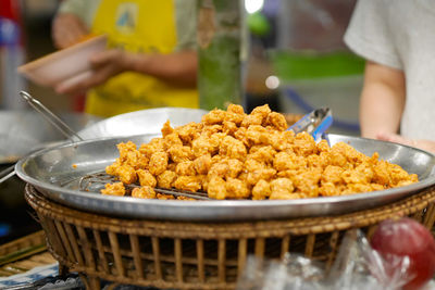 Midsection of man preparing food