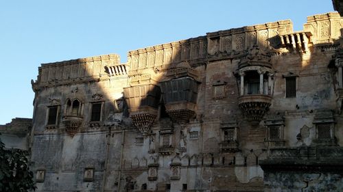 Low angle view of old building against clear sky