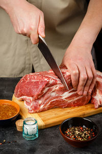 Midsection of man preparing food on table