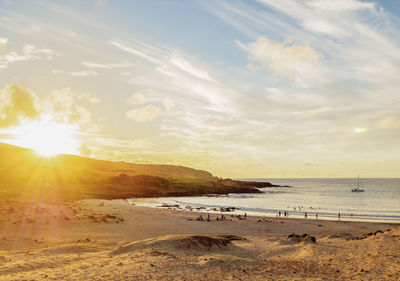 Scenic view of beach against sky during sunset