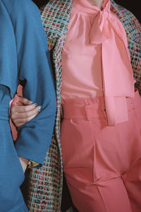 Fashion details of blue coat and pink blouse. lifestyle details. casual clothing