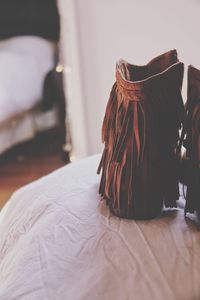 Close-up of mannequin on bed at home