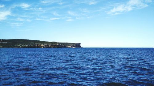 Scenic view of calm sea against sky