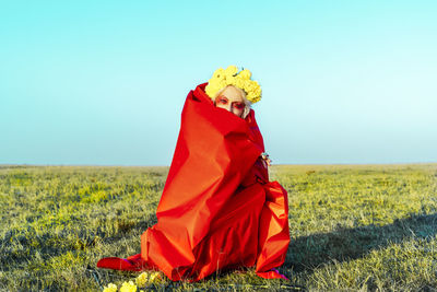 Side view of a woman on field