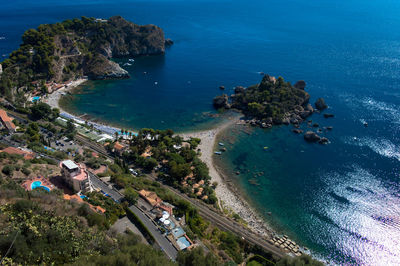 High angle view of sea by trees